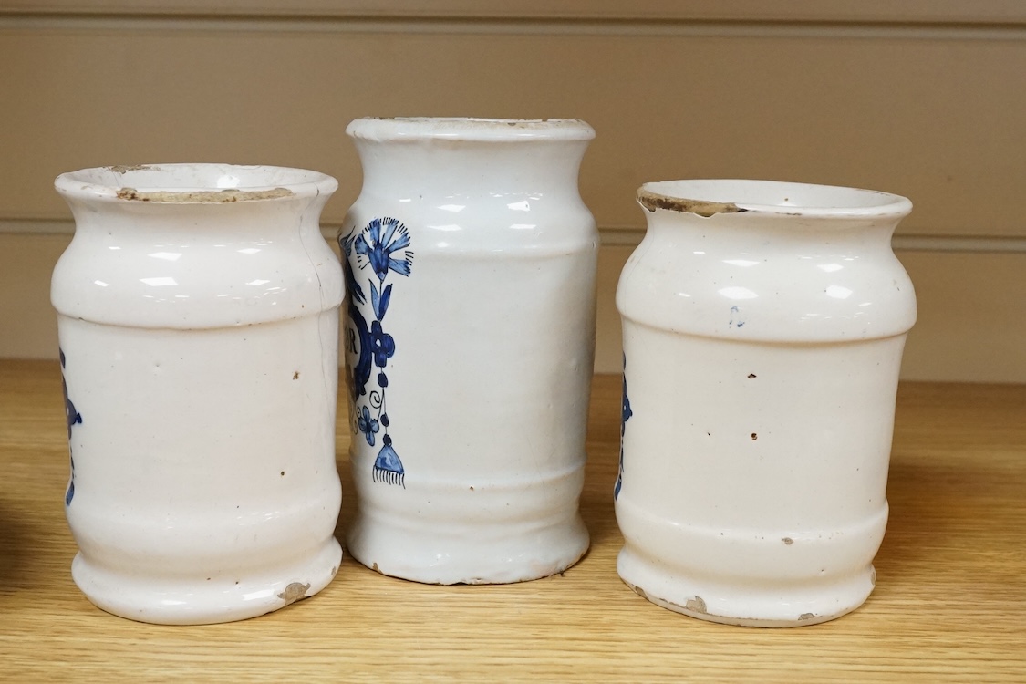 Three 18th century Delft blue and white drug jars; extract of rhubarb, Myrobol, and Conf. Hiacintor, largest 14cm high